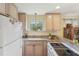 Bright kitchen with granite countertops, modern appliances, and ample cabinet space at 5817 Myrtle Ln, Tampa, FL 33625