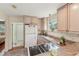 Well-lit kitchen featuring granite countertops, modern appliances, and convenient access to other rooms at 5817 Myrtle Ln, Tampa, FL 33625