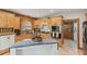 Beautiful kitchen featuring wooden cabinets, tile floors, stainless steel appliances, and lots of counter space at 5817 Myrtle Ln, Tampa, FL 33625
