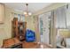Cozy living space with hardwood floors, display cabinet, and a door leading to an outdoor area at 5817 Myrtle Ln, Tampa, FL 33625