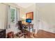 Bright office featuring a desk, chair, and natural light from the window, ideal for remote work at 5817 Myrtle Ln, Tampa, FL 33625