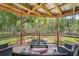 Relaxing outdoor seating area with comfortable chairs overlooking a tranquil pond at 5817 Myrtle Ln, Tampa, FL 33625