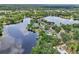 Waterfront homes lining the shore of a scenic lake, showcasing a tranquil and picturesque neighborhood at 5817 Myrtle Ln, Tampa, FL 33625