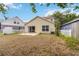 Great backyard space with sliding doors, patio, and a fenced yard at 5839 Meadowpark Pl, Lithia, FL 33547