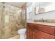Bathroom featuring tiled shower, granite countertop and wood vanity at 5839 Meadowpark Pl, Lithia, FL 33547