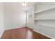 This bedroom boasts hardwood floors, built-in shelving and a window at 5839 Meadowpark Pl, Lithia, FL 33547
