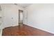 Bedroom features hardwood floors, closet and bathroom access at 5839 Meadowpark Pl, Lithia, FL 33547