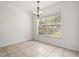 Dining area with tiled floors and a bright window offering natural light and views at 5839 Meadowpark Pl, Lithia, FL 33547