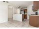 Bright kitchen area with tiled floor, wood cabinets, granite countertops, and stainless steel appliances at 5839 Meadowpark Pl, Lithia, FL 33547