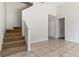 Inviting living room with tile flooring, stairway, and access to other rooms at 5839 Meadowpark Pl, Lithia, FL 33547