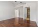 Spacious main bedroom featuring hardwood floors and access to two bathrooms at 5839 Meadowpark Pl, Lithia, FL 33547
