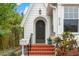 Home exterior showcasing brick steps leading to a front door with decorative planters at 626 16Th Ne Ave, St Petersburg, FL 33704