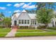 Charming home with a manicured front yard and a brick walkway leading to the front door at 626 16Th Ne Ave, St Petersburg, FL 33704