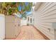 Backyard with a brick path and storage bin by the home at 626 16Th Ne Ave, St Petersburg, FL 33704
