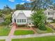 Charming single-Gathering home with a well-manicured lawn, lush landscaping, and inviting front porch at 626 16Th Ne Ave, St Petersburg, FL 33704