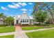 Charming single-Gathering home with a well-manicured lawn, lush landscaping, and inviting front porch at 626 16Th Ne Ave, St Petersburg, FL 33704