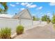 A detached garage with white fence and landscaped walkway at 626 16Th Ne Ave, St Petersburg, FL 33704