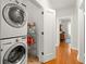 Convenient laundry area with stackable washer and dryer with shelf storage at 626 16Th Ne Ave, St Petersburg, FL 33704
