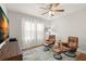 Relaxing living room featuring hardwood floors, leather chairs with ottomans, and natural lighting at 626 16Th Ne Ave, St Petersburg, FL 33704