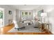 Inviting living room featuring hardwood floors and neutral-toned furniture at 626 16Th Ne Ave, St Petersburg, FL 33704