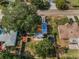 Aerial view of the home showing the backyard, detached storage shed, and trampoline at 629 Lexington St, Dunedin, FL 34698