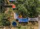 Aerial view highlighting the home's backyard with trampoline, swing set and storage shed at 629 Lexington St, Dunedin, FL 34698
