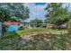 Large backyard with a shed and a trampoline, perfect for outdoor activities and storage at 629 Lexington St, Dunedin, FL 34698