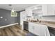 Bright kitchen with stainless appliances and views to another room at 629 Lexington St, Dunedin, FL 34698