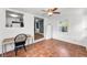 Sunroom featuring tiled floor, a desk, and views of the kitchen, creating a versatile space at 629 Lexington St, Dunedin, FL 34698