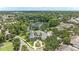 Luxury home with mature trees and landscaping featuring a lake view, community pool, and clubhouse at 6820 Muncaster Ct, Tampa, FL 33625