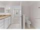Bathroom featuring double granite vanity, toilet in separate area, and view into the bedroom at 6820 Muncaster Ct, Tampa, FL 33625