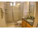 Bathroom featuring glass enclosed shower with a modern granite vanity and sink at 6820 Muncaster Ct, Tampa, FL 33625