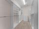 Walk-in closet with carpet and built-in shelving, perfect for organizing clothes and accessories at 6820 Muncaster Ct, Tampa, FL 33625