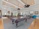 A clubhouse offering both dining and recreational activities, including a full kitchen and a billiard table for residents at 6820 Muncaster Ct, Tampa, FL 33625