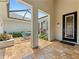 Inviting courtyard featuring brick pavers, potted plants, and a dining area at 6820 Muncaster Ct, Tampa, FL 33625