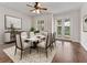 A dining room with hardwood flooring and french doors opening to the backyard at 6820 Muncaster Ct, Tampa, FL 33625