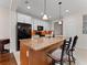 Stylish kitchen island with granite countertops, pendant lighting, and a breakfast bar at 6820 Muncaster Ct, Tampa, FL 33625