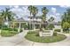 The Lake House offers a stately community building with lush landscaping and a grand entrance at 6820 Muncaster Ct, Tampa, FL 33625