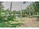 Scenic lake view with mature trees surrounding the serene water, creating a peaceful setting at 6820 Muncaster Ct, Tampa, FL 33625