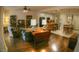 Inviting living room that offers an open-concept layout with hardwood floors, seamlessly connecting to the kitchen and dining areas at 6820 Muncaster Ct, Tampa, FL 33625