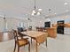 Open-concept living room flowing into the dining area and kitchen with bright and inviting interiors at 6820 Muncaster Ct, Tampa, FL 33625