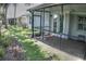 A screened patio overlooks a well-maintained lawn, ideal for outdoor enjoyment at 6820 Muncaster Ct, Tampa, FL 33625