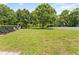 Community playground offering a safe and fun environment with lush green grass and comfortable seating for caregivers at 6820 Muncaster Ct, Tampa, FL 33625