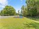 Neighborhood playground complete with a swing set and slide, fenced-in for added safety and peace of mind at 6820 Muncaster Ct, Tampa, FL 33625