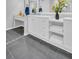Modern bathroom boasts custom vanity, spacious countertop, and ample storage for essentials at 714 1St Ct, Palm Harbor, FL 34684