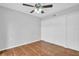 An empty room with tiled floors, ceiling fan and double closet doors at 714 1St Ct, Palm Harbor, FL 34684