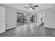 A bright bedroom with vinyl floors and access to a private balcony at 714 1St Ct, Palm Harbor, FL 34684
