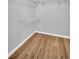 A simple closet with wire shelving and a window to organize your wardrobe at 714 1St Ct, Palm Harbor, FL 34684