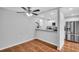 Bright dining area featuring tile floors, modern lighting, and seamless flow to the kitchen at 714 1St Ct, Palm Harbor, FL 34684