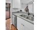 Stylish kitchen with a stainless steel dishwasher and granite countertops at 714 1St Ct, Palm Harbor, FL 34684
